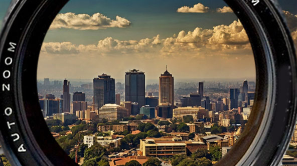 Johannesburg skyline with camera lens, representing local videography services