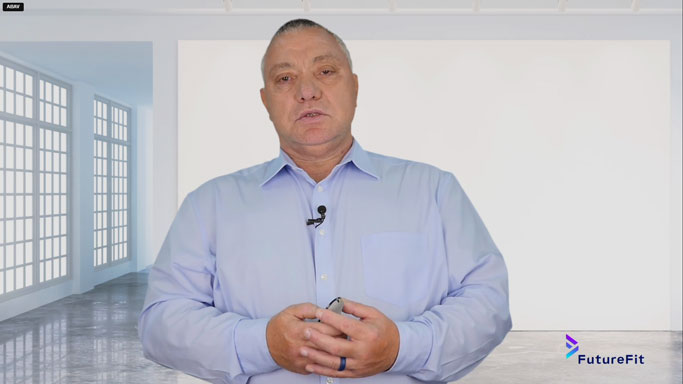 Professional presenter standing in front of a large green screen in a Johannesburg video production studio