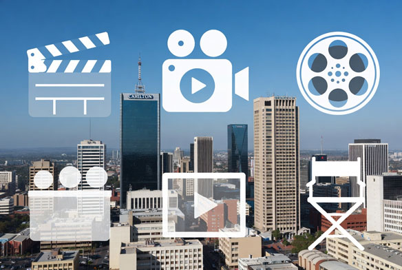 Johannesburg skyline with overlay of video production icons for marketing.